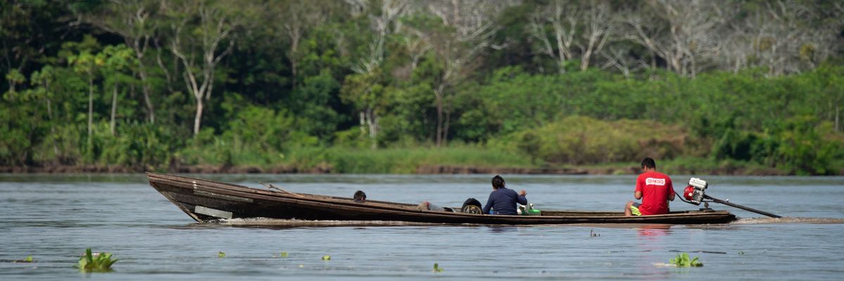 Locals ride a boat on the Marañón River