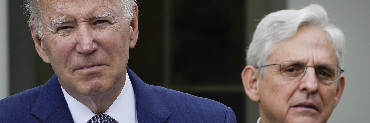 looks on as U.S. President Joe Biden