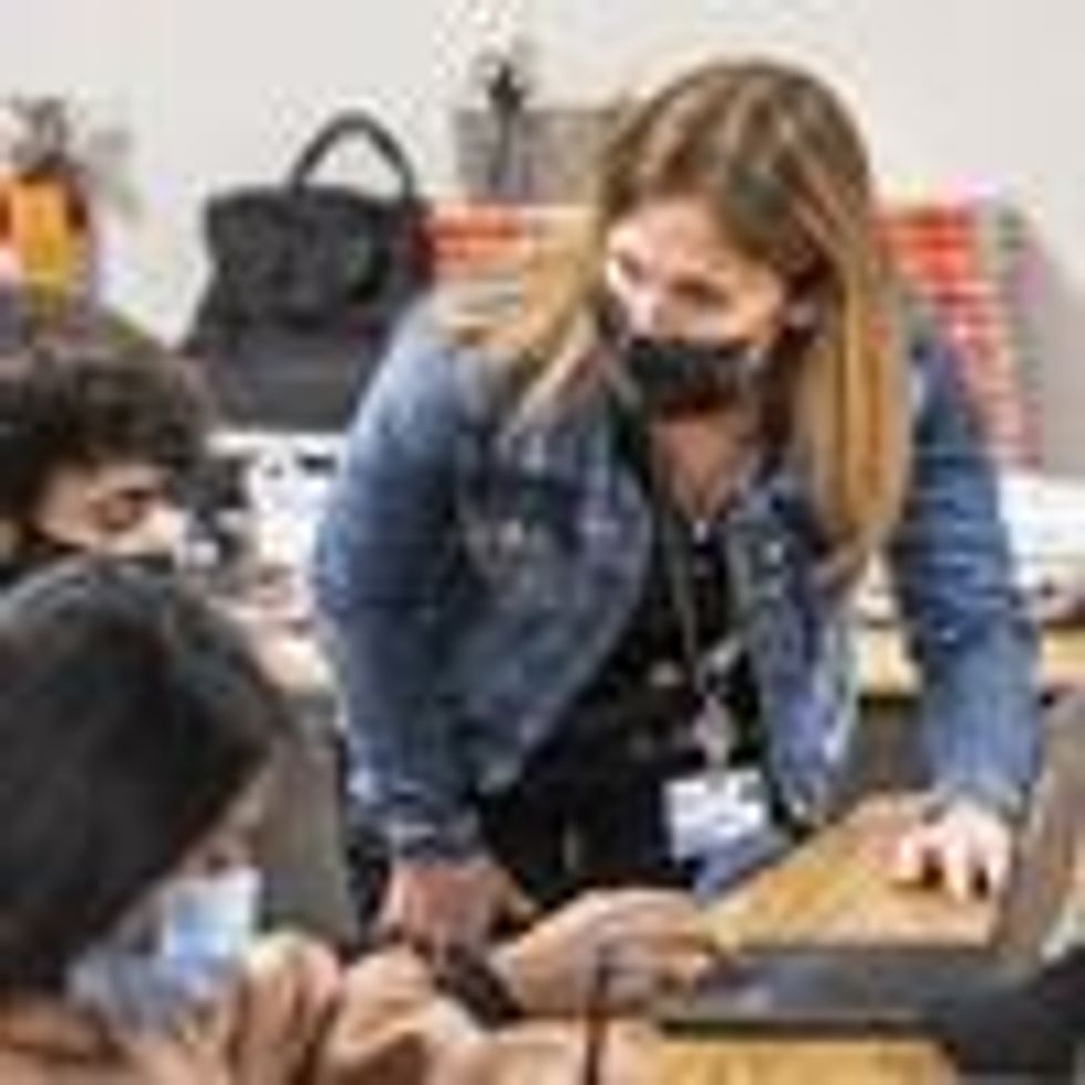 Lori Manz, who is normally a curriculum specialist in the Teaching and Learning Department at the Ocean View School District, substitute teaches in a 7th grade math class at Vista View Middle School in Huntington Beach, Calif. on Thursday, January 20, 2022.