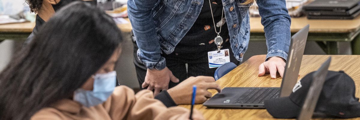 Lori Manz, who is normally a curriculum specialist in the Teaching and Learning Department at the Ocean View School District, substitute teaches in a 7th grade math class at Vista View Middle School in Huntington Beach, Calif. on Thursday, January 20, 2022.