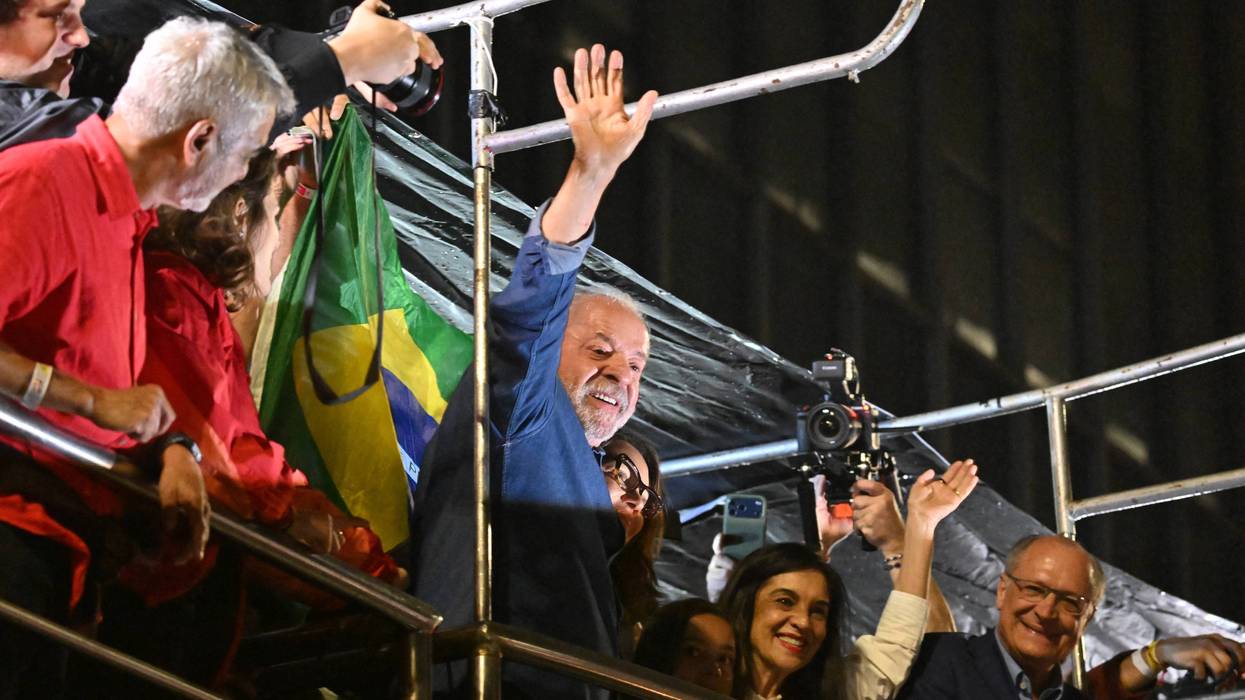 Lula waves to supporters after winning reelection