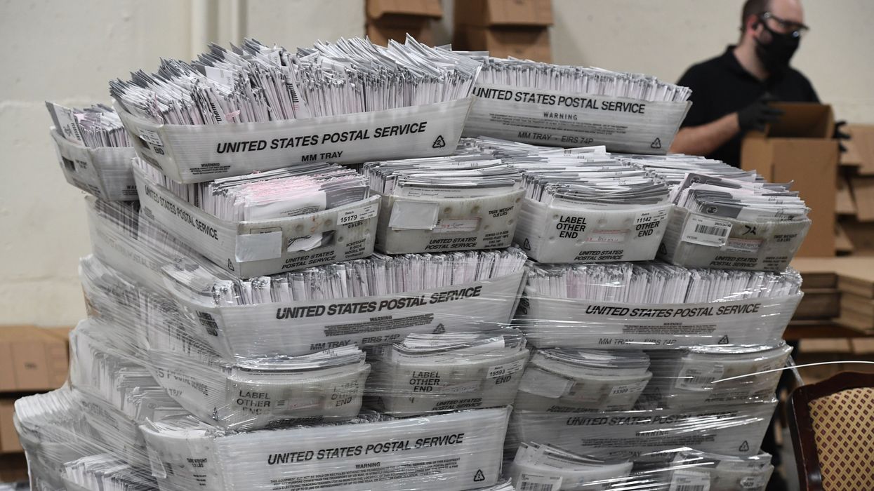 Mail-in ballots in boxes.