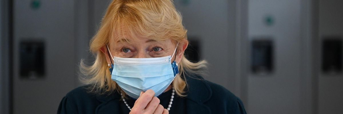Maine Gov. Janet Mills adjusts her mask as she talks with the press during a visit to MaineHealth's high-volume vaccination clinic at Scarborough Downs on Friday, March 5, 2021.