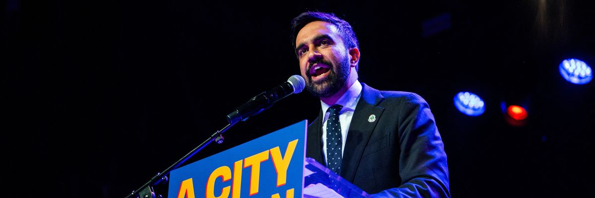 Mamdani speaks at a podium that has a sign that says "a city we can afford."