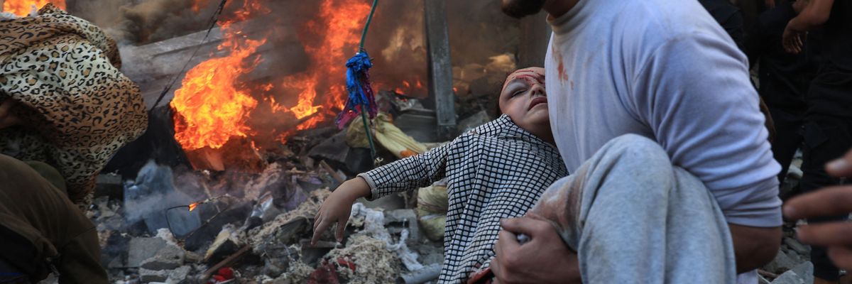 man evacuates a wounded girl