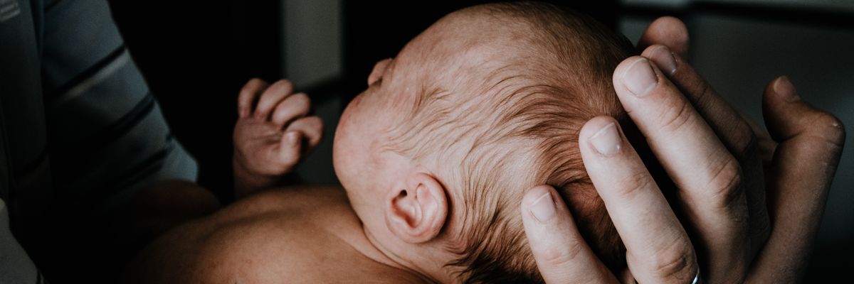 Man holding baby.