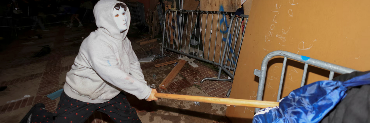 man in mask wielding wooden stick