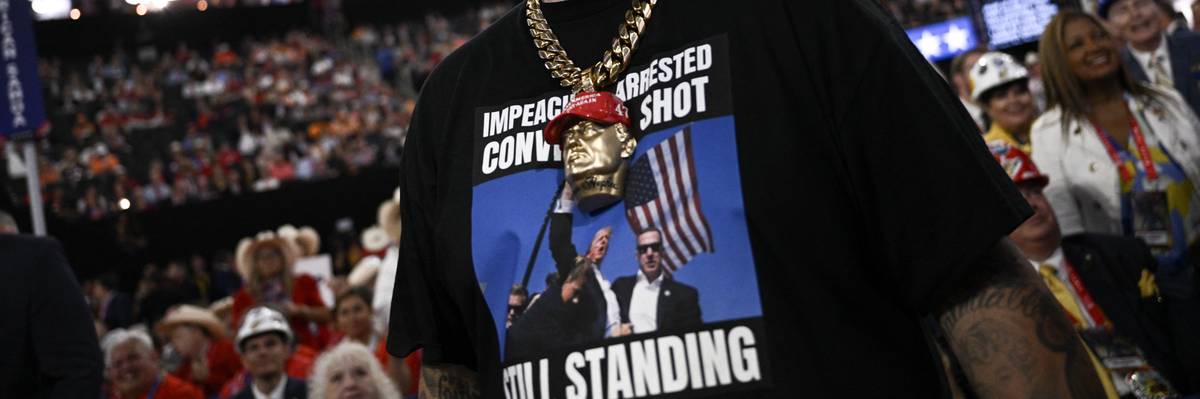Man wears t-shirt of Trump after the assassination attempt.