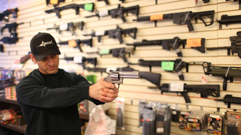 Man with a gun in gun store