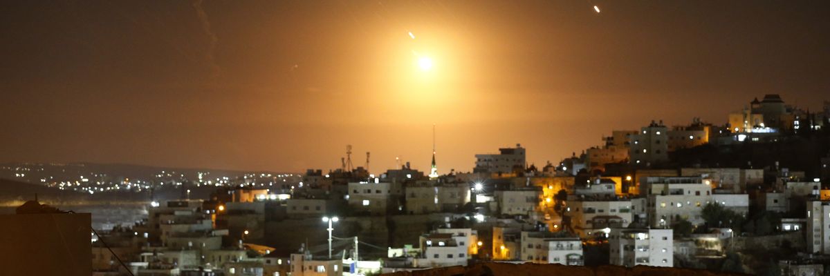 Many rockets, fired from Iran, are seen over Jerusalem from Hebron, West Bank
