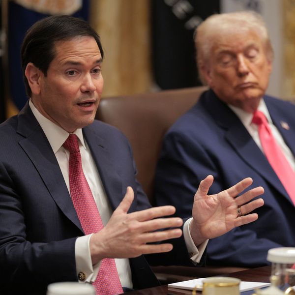 Marco Rubio speaks while Donald Trump looks on