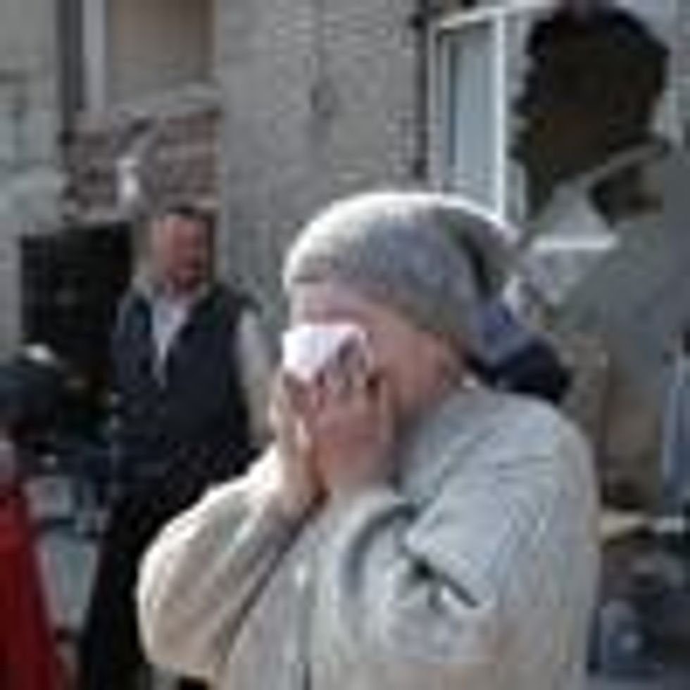 Mariupol residents are seen in the city