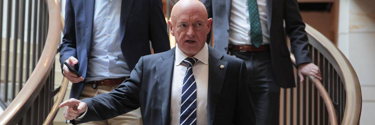 Mark Kelly arrives for a meeting.