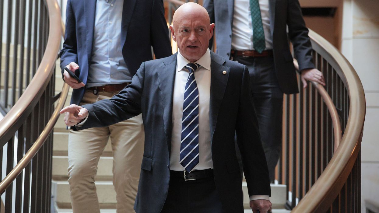 Mark Kelly arrives for a meeting.