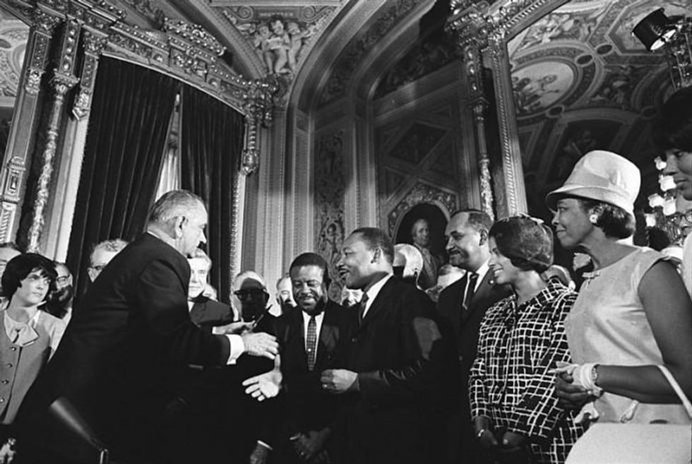 Martin Luther King, Jr. and other Civil Rights leaders meet Lyndon B. Johnson at the signing of the Voting Rights Act in 1965.