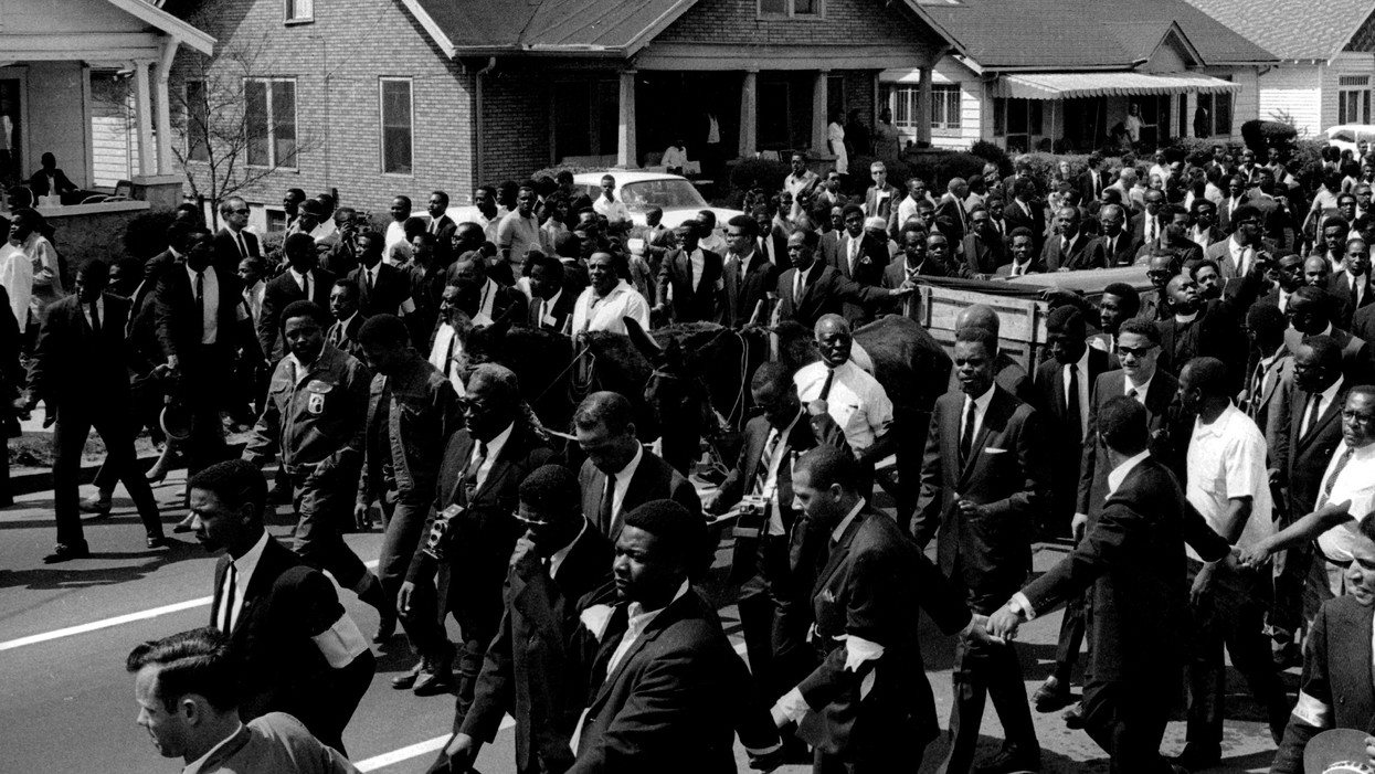 Martin Luther King's casket, borne on a mule-drawn cart, moves through Atlanta