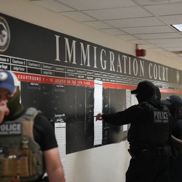 Masked federal officers lurk in an immigration court