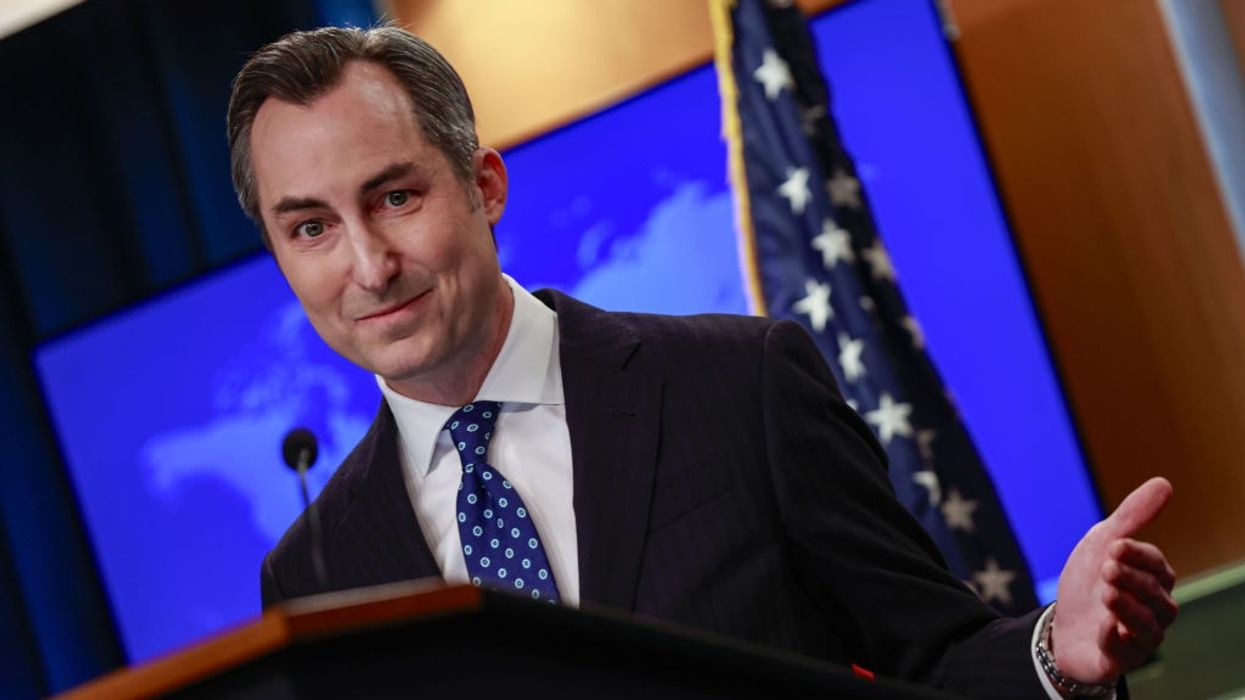 Matthew Miller smirks