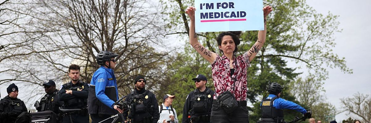 Medicaid recipient Emily Gabriella protests outside the U.S. Supreme Court