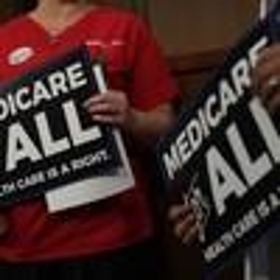 Medicare for All supporters hold signs during an event on Capitol Hill