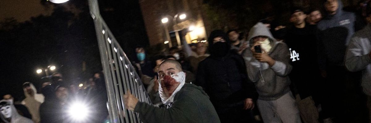 Member of pro-genocide mob throws fence