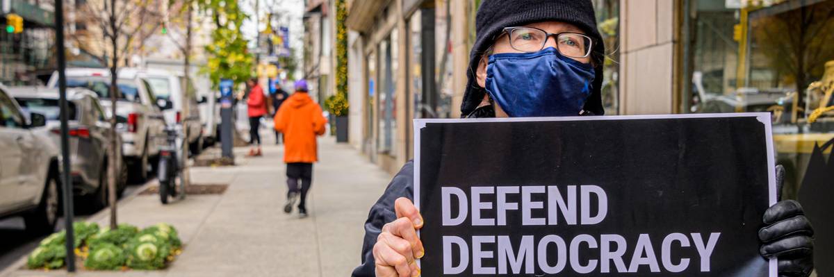 Members of the activist group Rise and Resist gathered outside Rudy Giuliani's Manhattan apartment building