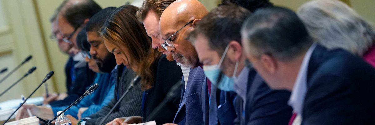 Members of the DNC Resolutions Committee attend a meeting