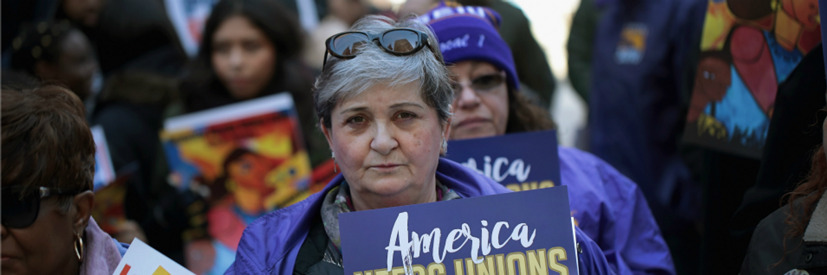 Members of the Service Employees International Union (SEIU) hold a rally at the Richard J. Daley Center plaza on February 26, 2018 in Chicago