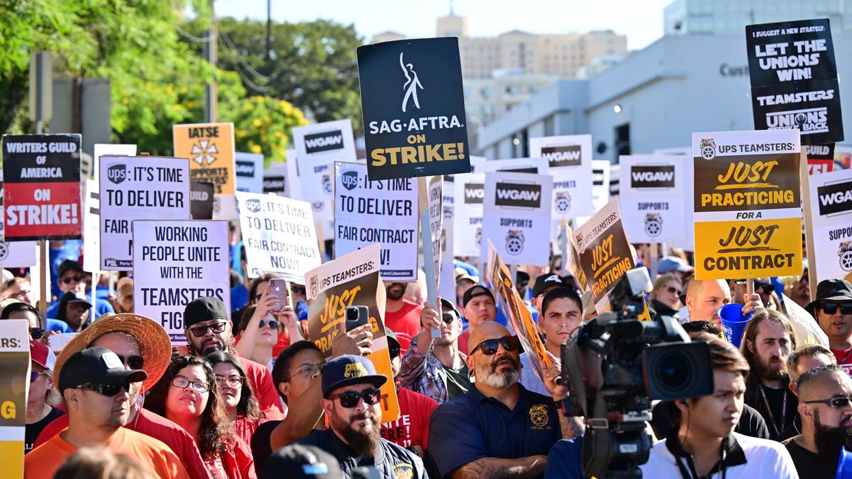 Members of the Writers Guild of America join UPS Teamsters during a rally