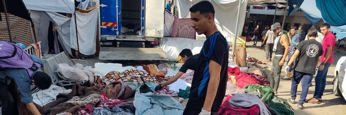 Men check bodies of bombing victims in Gaza.