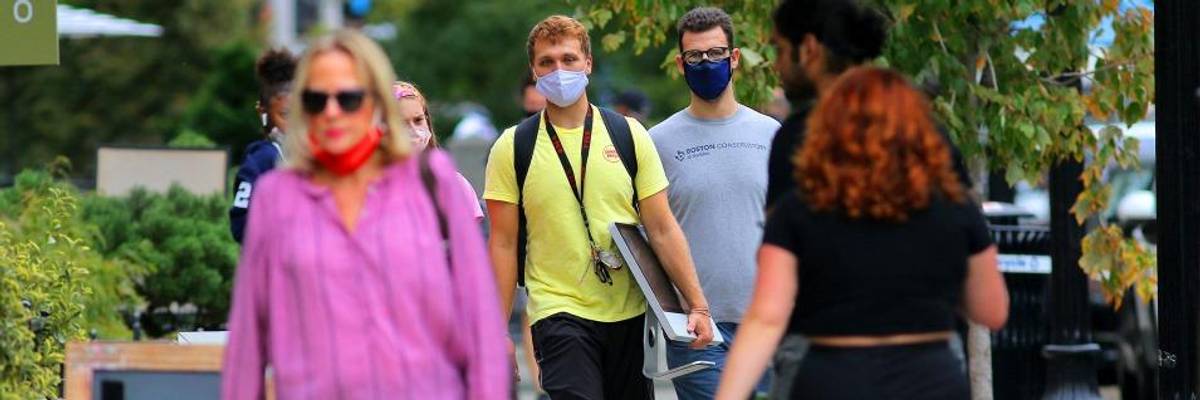 Men wearing masks on Newbury Street in Boston