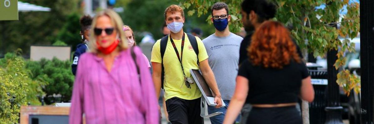 Men wearing masks on Newbury Street in Boston