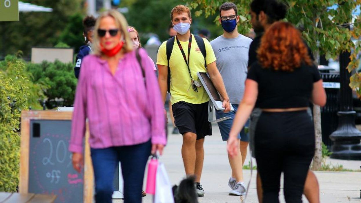 Men wearing masks on Newbury Street in Boston