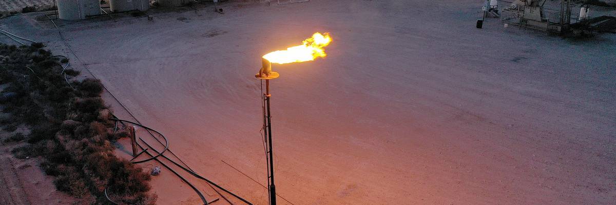 Methane gas is flared off during a drilling operation in the Permian Basin oil field on March 12, 2022 in Stanton, Texas.