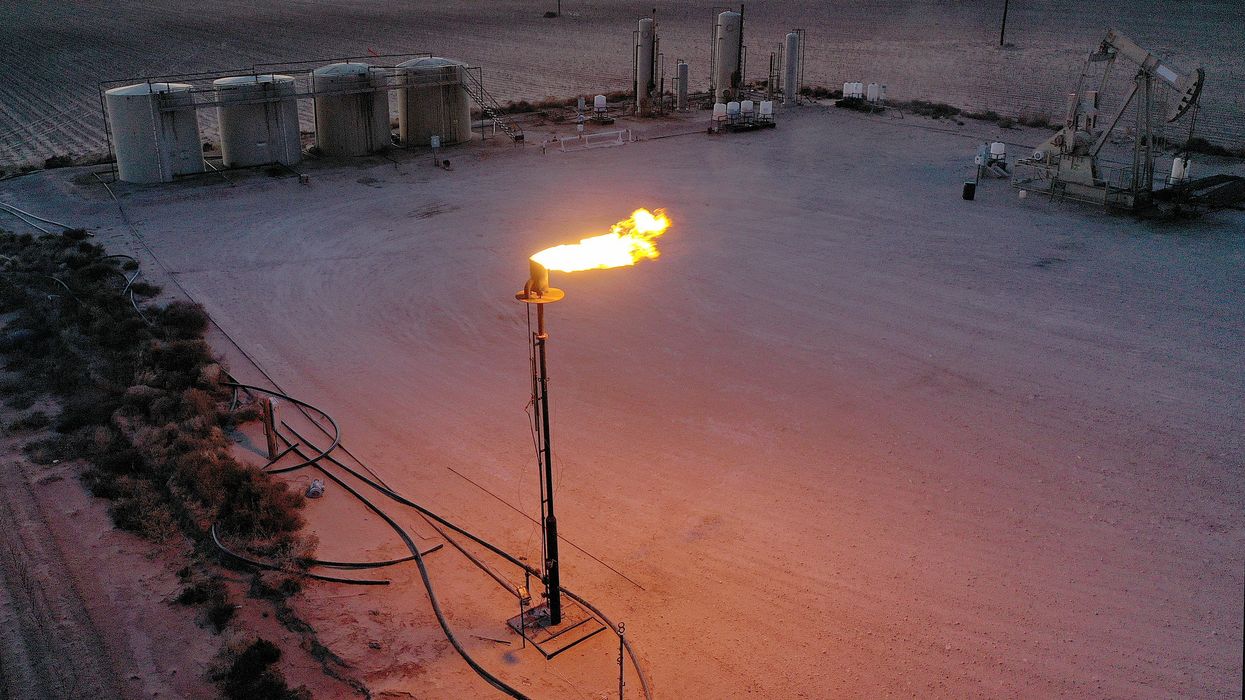 Methane gas is flared off during a drilling operation in the Permian Basin oil field on March 12, 2022 in Stanton, Texas.