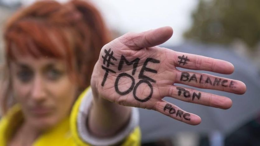 #MeToo written on a hand at a protest