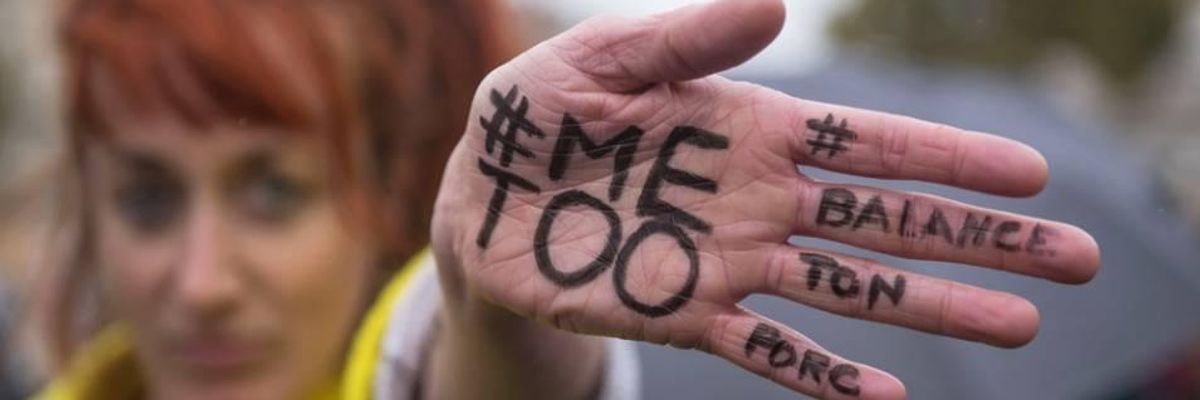 #MeToo written on a hand at a protest