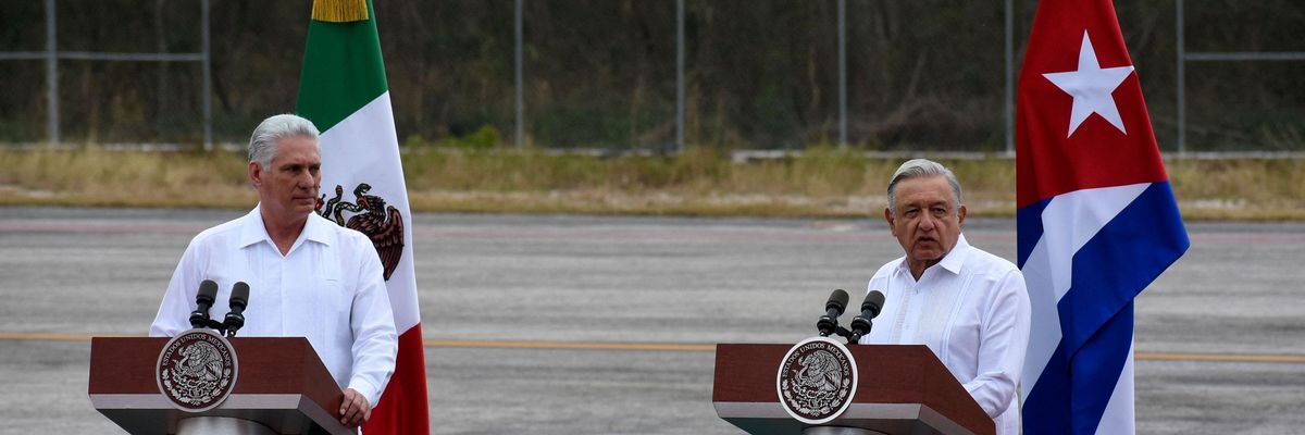 Mexican President Andrés Manuel López Obrador (right) introduces Cuban President Miguel Díaz-Canel during a welcome ceremony at Campeche International Airport on February 11, 2023.