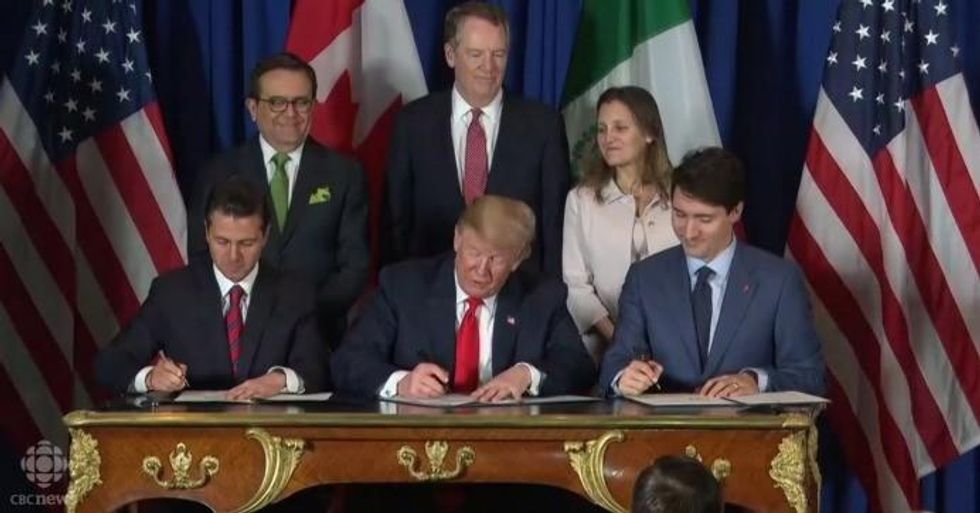 Mexican President Enrique Pena Nieto, U.S. President Donald Trump, and Canadian Prime Minister Justin Trudeau sign the new trade agreement to replace NAFTA on Friday, Nov. 30, 2018. (Screengrab via CBC News)