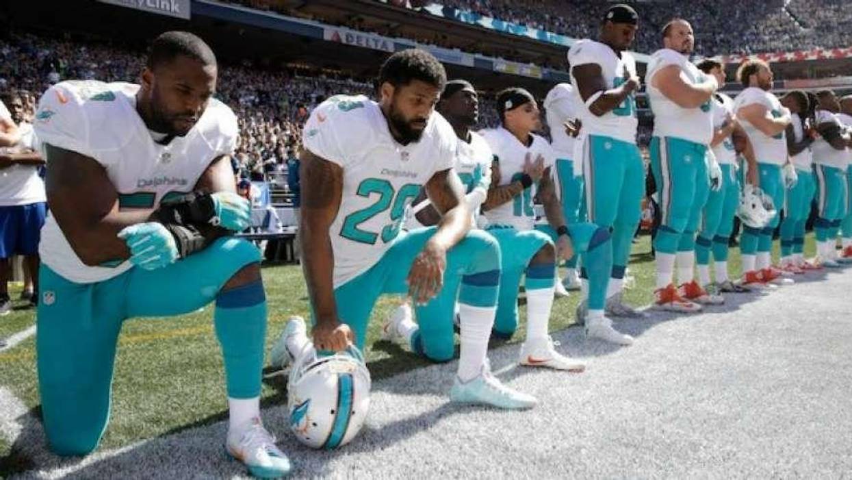 Miami Dolphins take a knee
