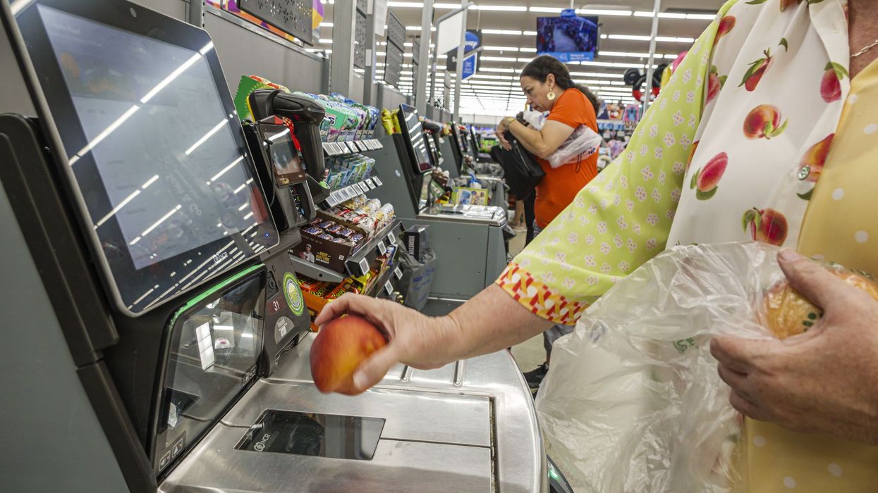 Miami Doral Florida, Walmart Supercenter, self checkout lane close view, customer scanning fresh fruit apple produce
