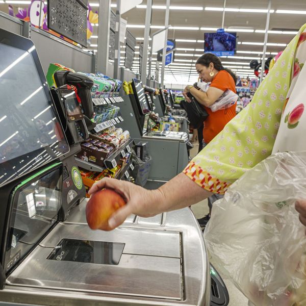 Miami Doral Florida, Walmart Supercenter, self checkout lane close view, customer scanning fresh fruit apple produce