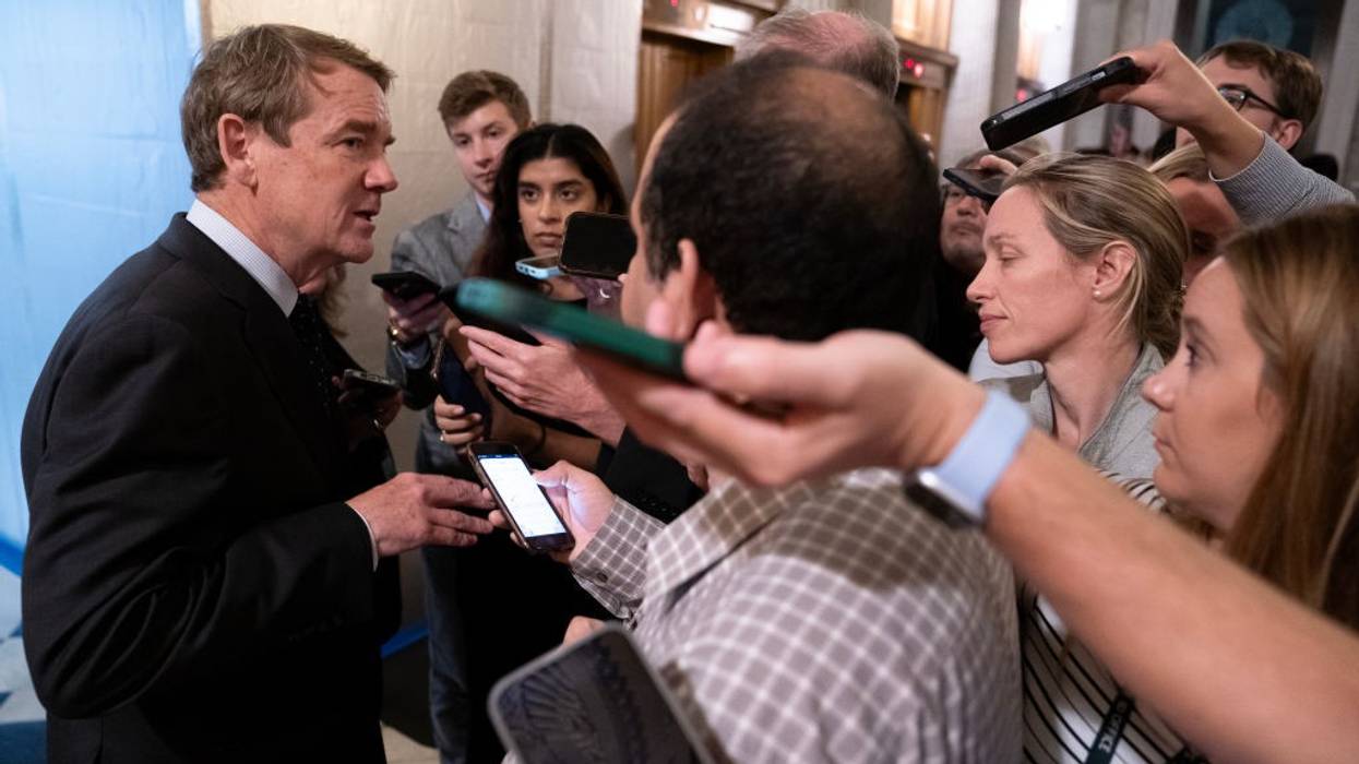 Michael Bennet speaks to reporters.