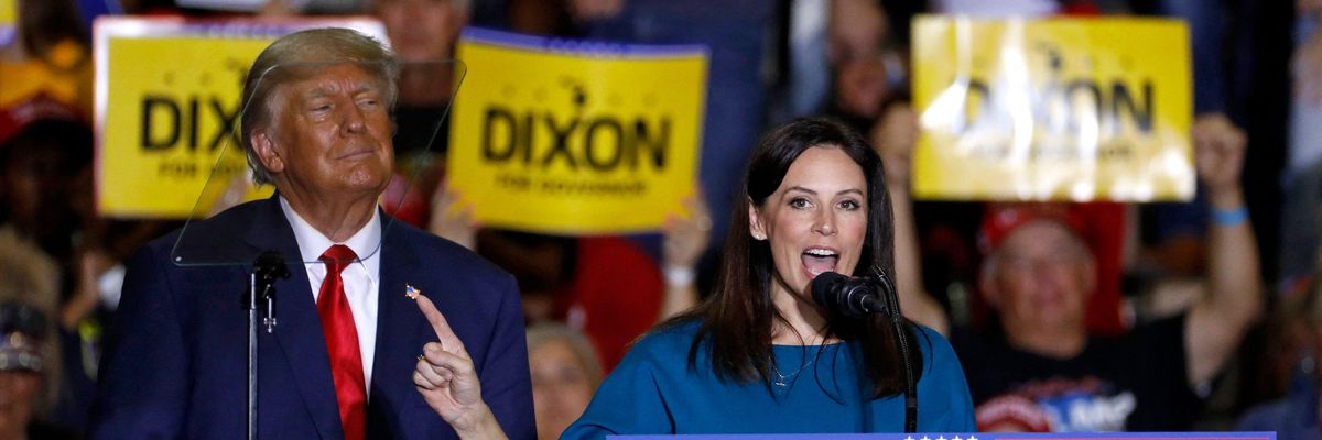 Michigan Republican gubernatorial candidate Tudor Dixon speaks alongside former U.S. President Donald Trump during a rally in Warren, Michigan on October 1, 2022.