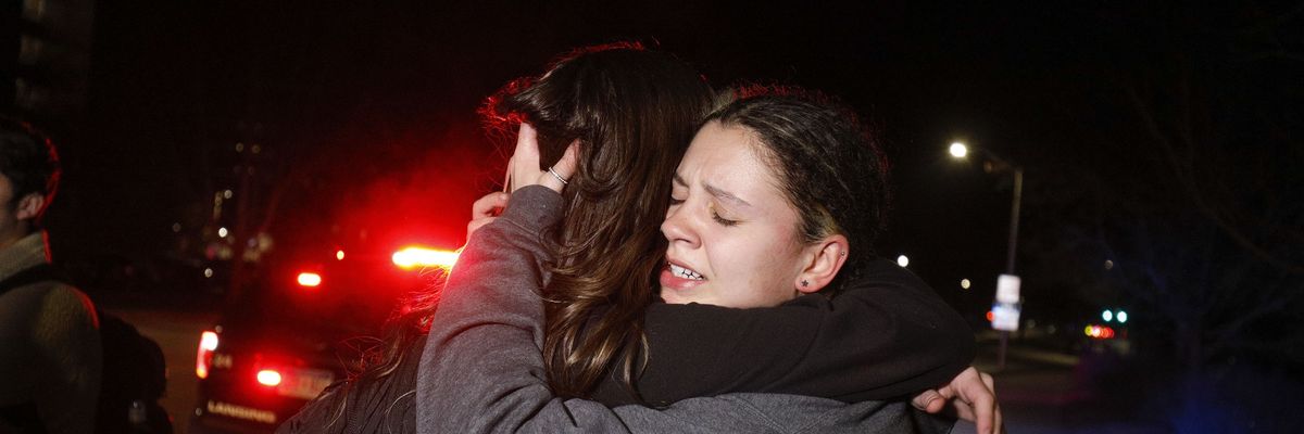 Michigan State University students hug during an active shooter situation