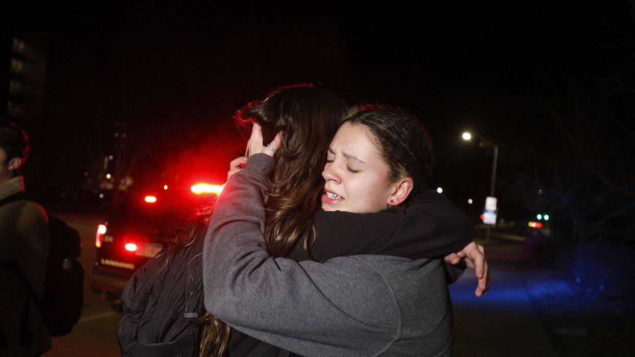 Michigan State University students hug during an active shooter situation