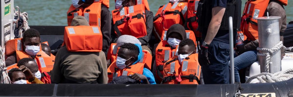 Migrants are intercepted by Border Force officials after crossing the English Channel.