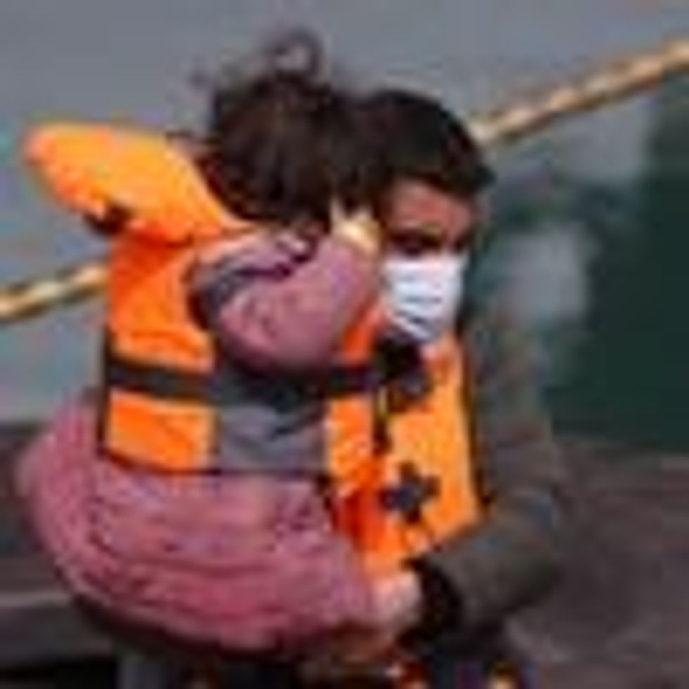 Migrants arrive at a port in Dover, England on April 14, 2022, the day the U.K. government announced it will process people seeking asylum in Britain more than 4,000 miles away in Rwanda.