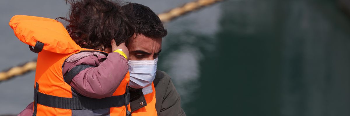 Migrants arrive at a port in Dover, England on April 14, 2022, the day the U.K. government announced it will process people seeking asylum in Britain more than 4,000 miles away in Rwanda.