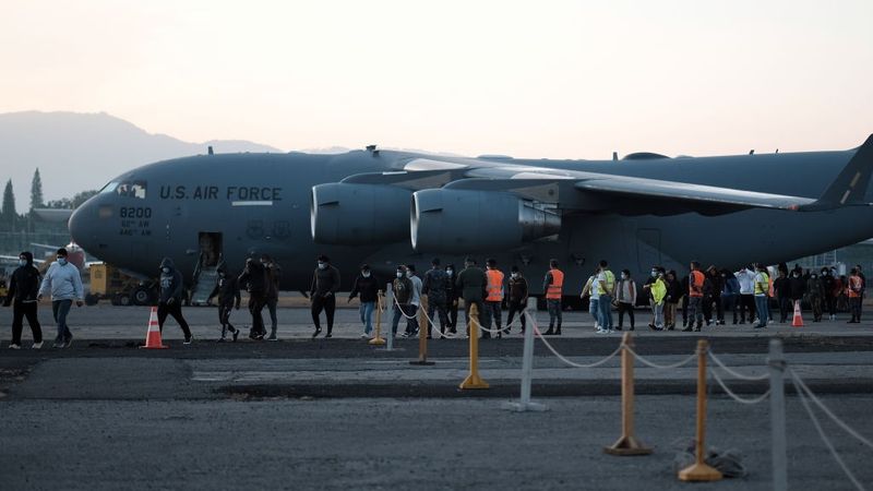 Migrants arrive from US in a military plane at la Aurora air base in Guatemala